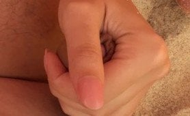 Handjob and he cum on her tits on the beach. 