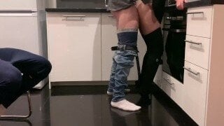 A cute wife gets fucked in the kitchen as husband watches