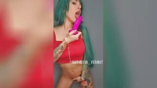 This sexy green hair babe is so hungry for cock that she goes to her bedroom, takes out her dildo, and sucks it to her satisfaction.